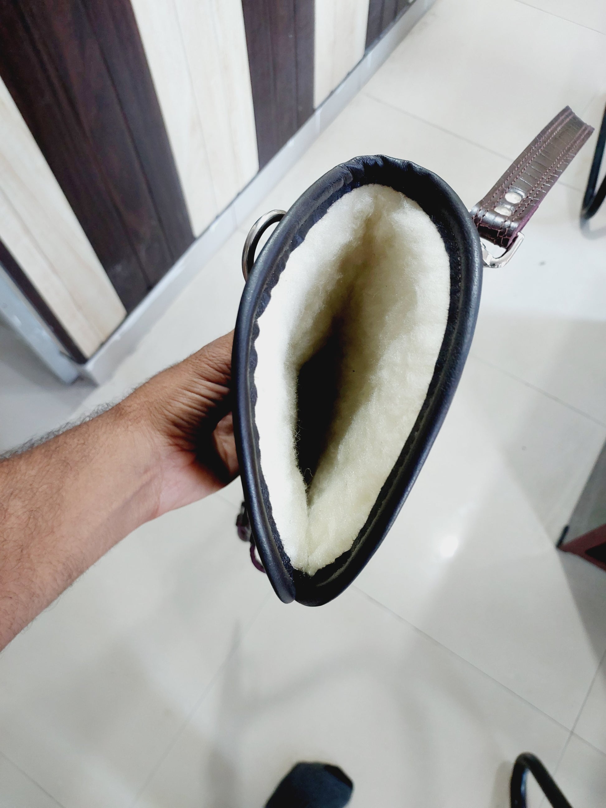 33 inch croc embossed leather rifle scabbard with adjustable strap

Rifle case mounted on wooden wall – western leather design

Inside view of fleece-lined gun scabbard

Full-length view of rifle scabbard with stainless hardware

Leather scabbard displayed on floor – cowboy style

Zoom-in of croc leather pattern with hook and buckle

Hand-holding leather rifle scabbard – easy grip

Informative banner for croc leather scabbard – genuine leather, stainless hardware

Rifle inside scabbard – ammo loop visible