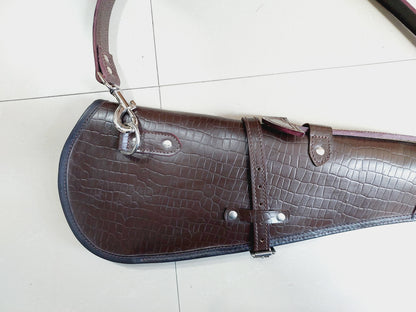33 inch croc embossed leather rifle scabbard with adjustable strap

Rifle case mounted on wooden wall – western leather design

Inside view of fleece-lined gun scabbard

Full-length view of rifle scabbard with stainless hardware

Leather scabbard displayed on floor – cowboy style

Zoom-in of croc leather pattern with hook and buckle

Hand-holding leather rifle scabbard – easy grip

Informative banner for croc leather scabbard – genuine leather, stainless hardware

Rifle inside scabbard – ammo loop visible