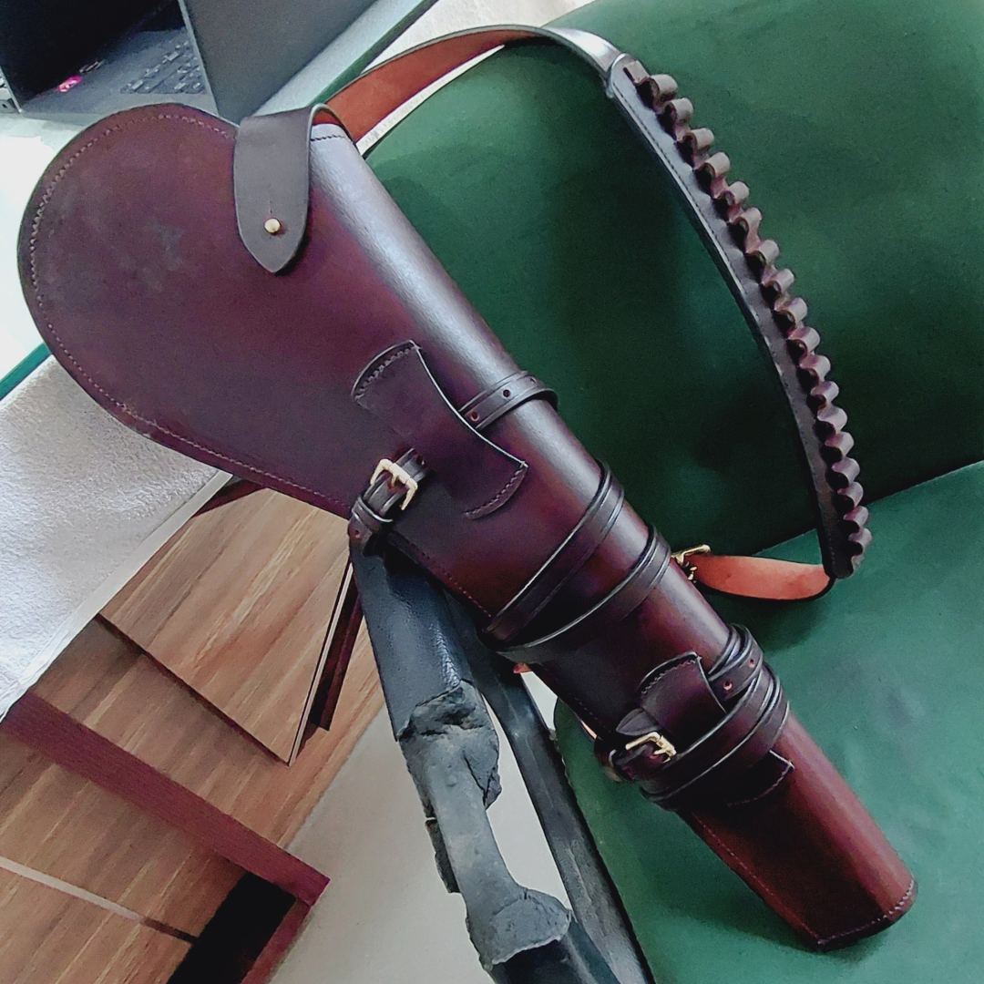 Black 22 inch rifle scabbard with shoulder strap on outdoor surface

Rifle case measurements: 22" long, 8" top width, 3.5" bottom width

Rifle scabbard with attached ammo loop and adjustable sling