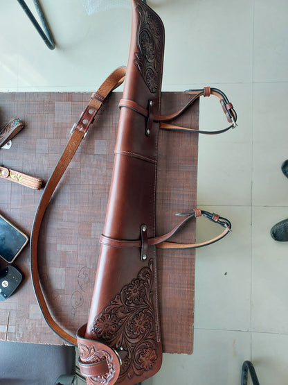 Hand-tooled leather rifle scabbard 33 inch long

Western leather gun cover with adjustable straps

Full grain leather rifle case for lever action rifles

Cowboy-style rifle scabbard for Marlin and Henry

Floral carved rifle cover with buckle flap

Handmade brown leather gun case for saddle mount