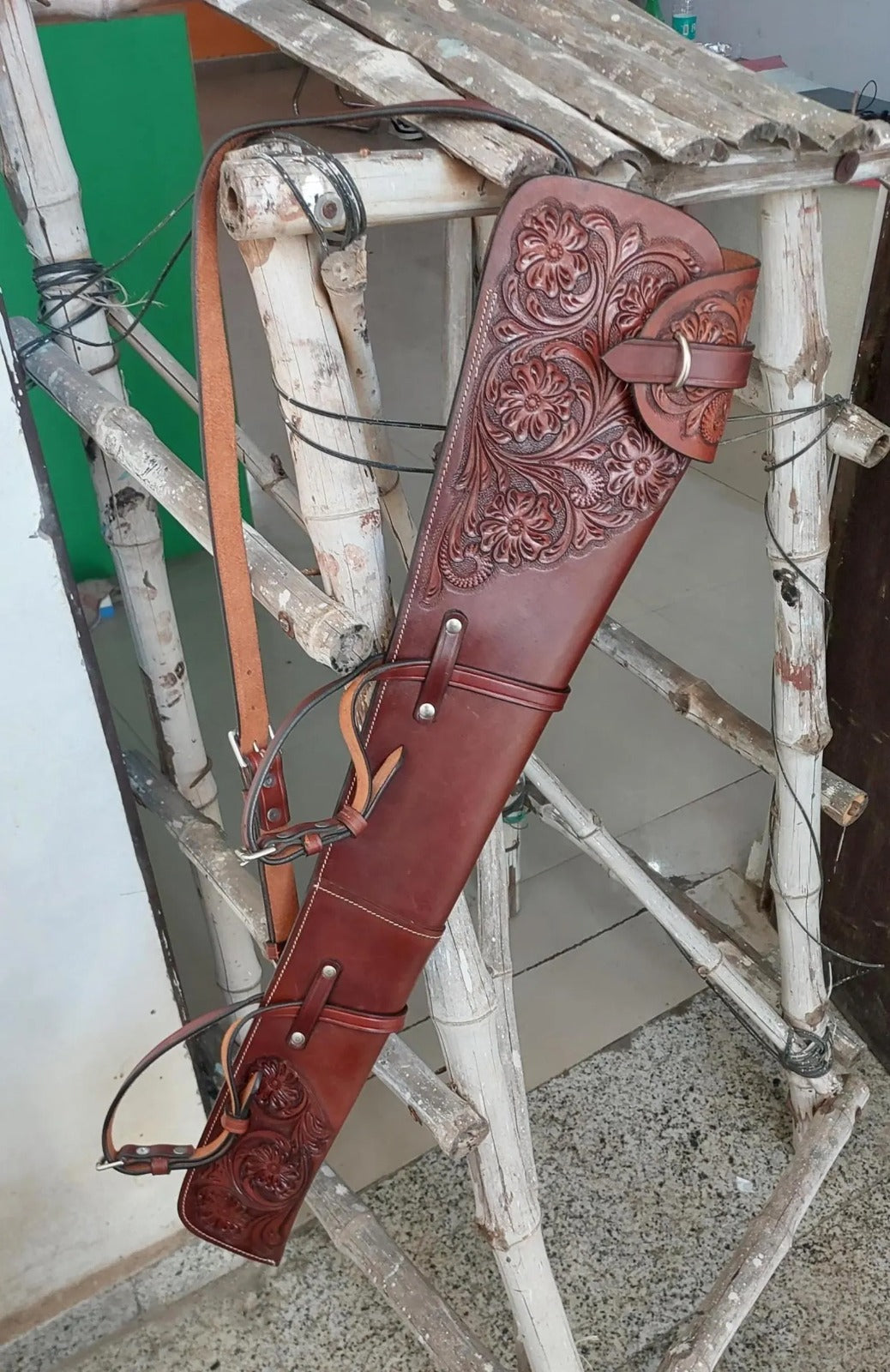 Hand-tooled leather rifle scabbard 33 inch long

Western leather gun cover with adjustable straps

Full grain leather rifle case for lever action rifles

Cowboy-style rifle scabbard for Marlin and Henry

Floral carved rifle cover with buckle flap

Handmade brown leather gun case for saddle mount