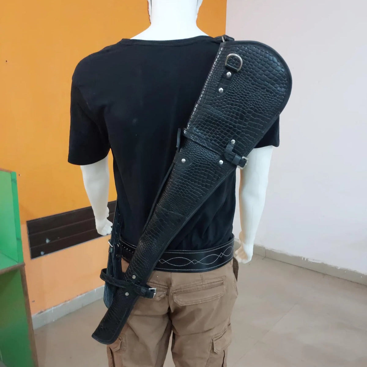 33 inch croc embossed leather rifle scabbard with adjustable strap

Rifle case mounted on wooden wall – western leather design

Inside view of fleece-lined gun scabbard

Full-length view of rifle scabbard with stainless hardware

Leather scabbard displayed on floor – cowboy style

Zoom-in of croc leather pattern with hook and buckle

Hand-holding leather rifle scabbard – easy grip

Informative banner for croc leather scabbard – genuine leather, stainless hardware

Rifle inside scabbard – ammo loop visible